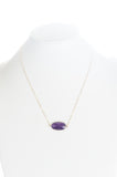 Amethyst stone set in gold bezel with gold chain