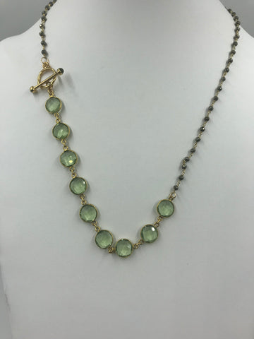 Amethyst (green) in gold bezel with hematite rosary chain