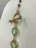 Amethyst (green) in gold bezel with hematite rosary chain