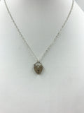 Silver heart-shaped locket and silver chain